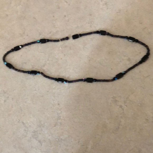 This fun necklace is strung on a stretchy twine - Picture 2 of 4